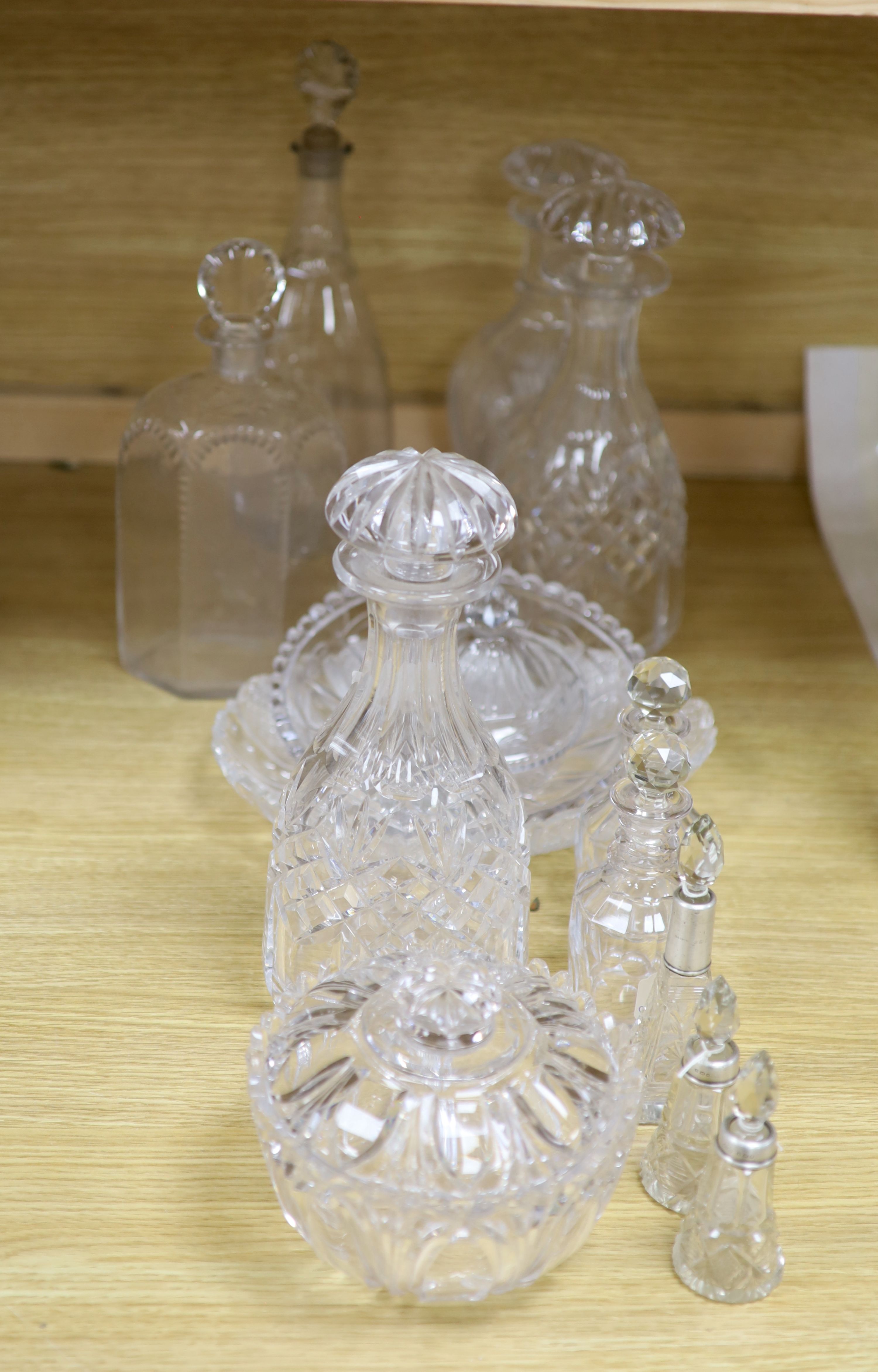 A pair of cut glass decanters, two others and mixed cut glass